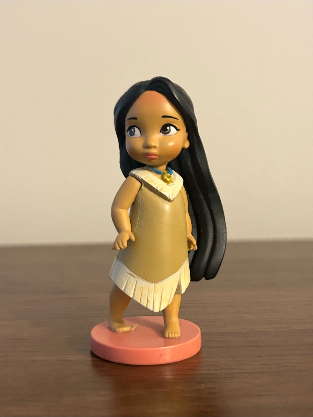 Collectible Figurine in Tan Dress with Black Hair